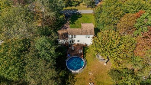 an aerial view of a house with a swimming pool at Cedar Cove Retreat Pool BBQ Game Room in Albrightsville