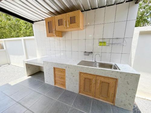Kuchyň nebo kuchyňský kout v ubytování Mango Villa