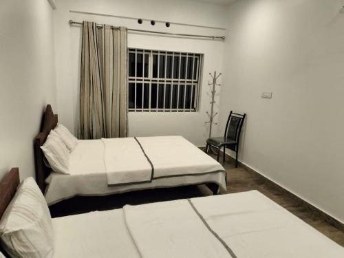 En eller flere senge i et værelse på Windy MOUNTAIN