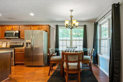 a kitchen with a table and a stainless steel refrigerator at 18 Larkspur Ln Emerson in Emerson