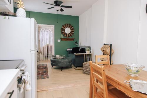 a kitchen and living room with a table and a refrigerator at B Hotel in Toronto
