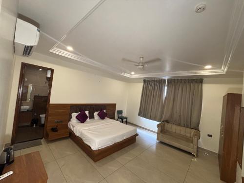 Ένα ή περισσότερα κρεβάτια σε δωμάτιο στο Hotel Park Areca, Jaipur
