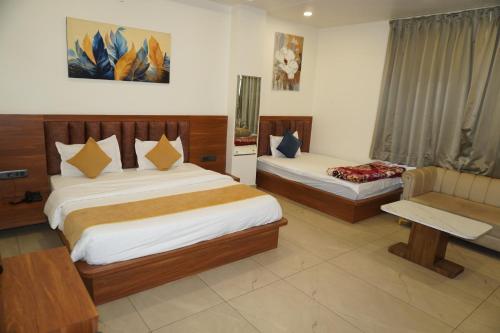 Ένα ή περισσότερα κρεβάτια σε δωμάτιο στο Hotel Park Areca, Jaipur