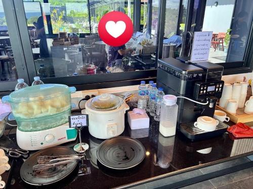 a counter top with a food processor and a mixer at GrandWara Khao Yai แกรนด์วารา เขาใหญ่ in Ban Nong Song Hong