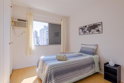 Llit o llits en una habitació de VOSS Itaim
