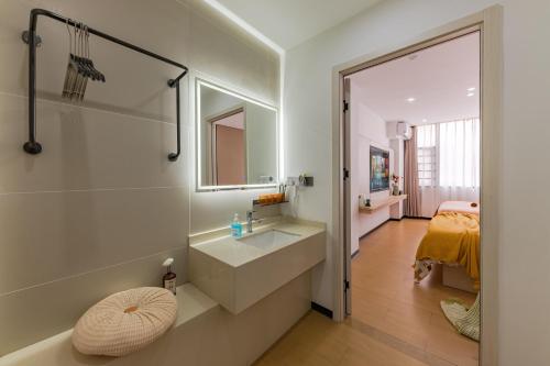 a bathroom with a sink and a mirror at 尚品9号海景民宿Seaview Hotel in Xiamen