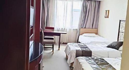 Katil atau katil-katil dalam bilik di Changchun Global Hotel