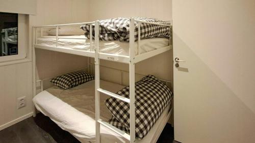 a couple of bunk beds in a room at Modern Lake House With Spa At Lake Barken in Sörbo