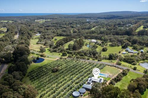 an aerial view of a vineyard with a house and trees at Ginahgulla Olive Estate I Private Properties in Margaret River Town