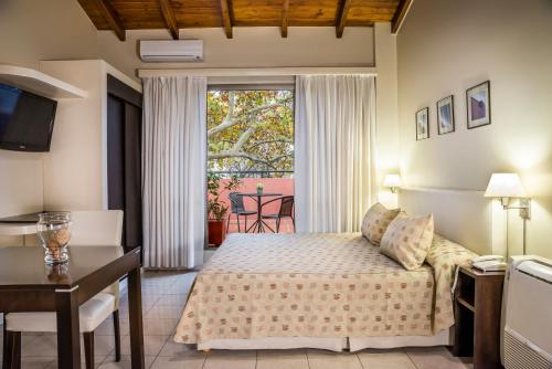 Postel nebo postele na pokoji v ubytování Montañas Azules Apart Hotel
