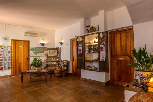 a living room with a couch and a table at Hotel Los Castaños in Cartajima