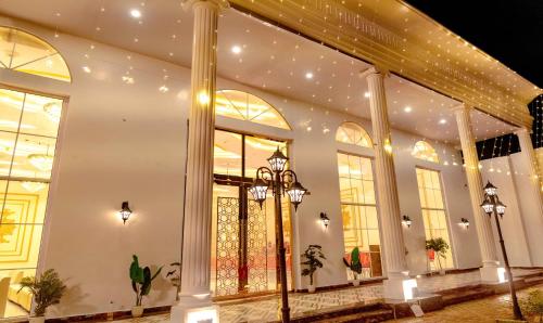 a store front with large windows and lights at The Golden leaf hotel in Gaya