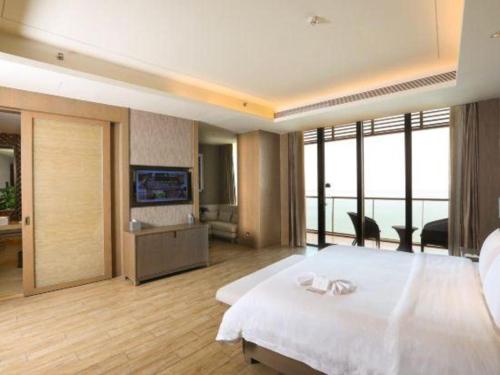 Postel nebo postele na pokoji v ubytování Mangrove Tree Resort World Qingdao