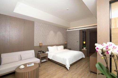Postel nebo postele na pokoji v ubytování Mangrove Tree Resort World Qingdao