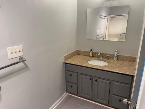 a bathroom with a sink and a mirror at La Cienega Soul in Los Angeles