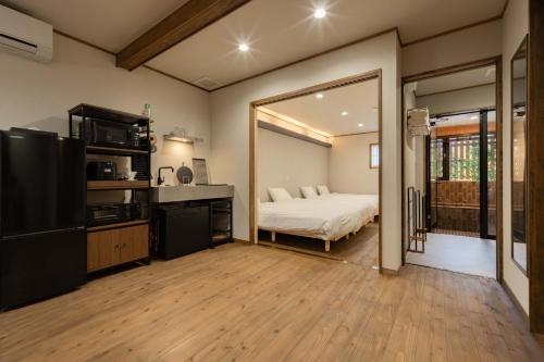 a bedroom with a bed and a large mirror at HidaTakayama MIYABI in Takayama