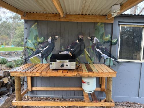 a wall with a painting of birds on it at Prospectors Rest in Maldon