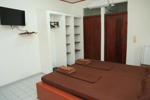 Postel nebo postele na pokoji v ubytování Sunil Lanka Hotel