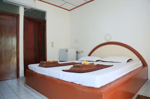 Postel nebo postele na pokoji v ubytování Sunil Lanka Hotel