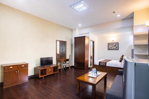TV a/nebo společenská místnost v ubytování Suite Homes, Serviced Apartment Hotel