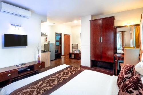 Postel nebo postele na pokoji v ubytování Suite Homes, Serviced Apartment Hotel