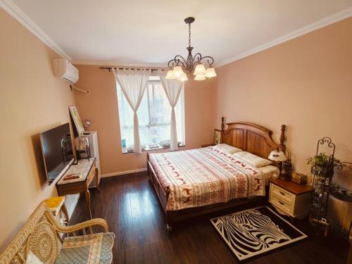 a bedroom with a bed and a window at koko's garden and cats --4mins walk from jingjusi metro st ation, English-speaking service in Chengdu