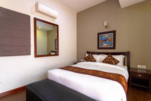 Postel nebo postele na pokoji v ubytování Suite Homes, Serviced Apartment Hotel