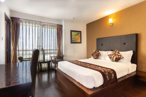 Postel nebo postele na pokoji v ubytování Suite Homes, Serviced Apartment Hotel