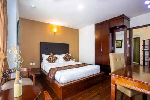 Postel nebo postele na pokoji v ubytování Suite Homes, Serviced Apartment Hotel