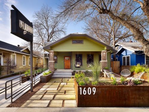 a house with a street sign in front of it at Heywood Hotel in Austin