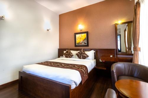 Postel nebo postele na pokoji v ubytování Suite Homes, Serviced Apartment Hotel