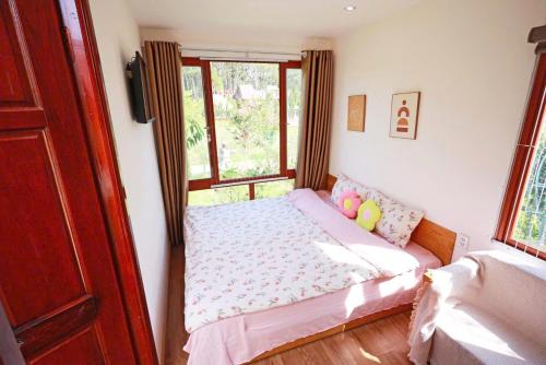 Ένα ή περισσότερα κρεβάτια σε δωμάτιο στο Homestay Gió Mộc