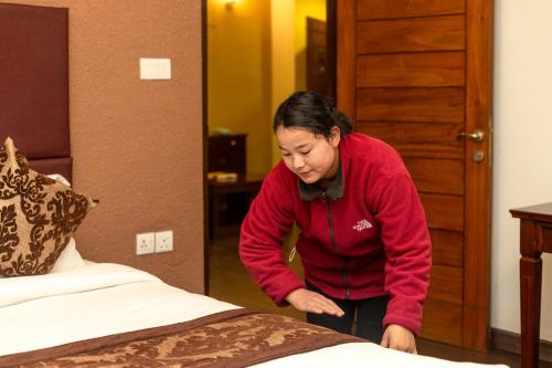 Postel nebo postele na pokoji v ubytování Suite Homes, Serviced Apartment Hotel