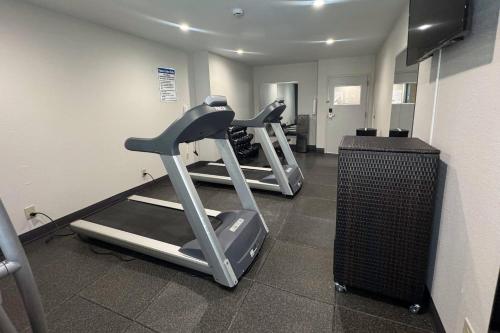a gym with two tread machines in a room at Quality Inn Chattanooga Hamilton Place in Chattanooga