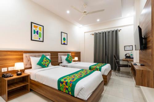 Cama o camas de una habitación en Treebo Prime Bliss Whitefield