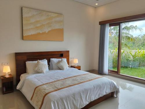 Postel nebo postele na pokoji v ubytování The Swasti Villa Ubud