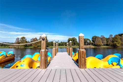 a dock with a bunch of inflatable boats in the water at Hyatt Regency Grand Cypress Resort - Free Shuttle to Theme Parks! in Orlando