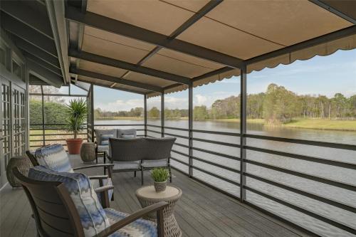 a screened in porch with a view of the water at Hyatt Regency Grand Cypress Resort - Free Shuttle to Theme Parks! in Orlando