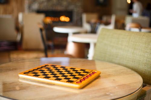 a chess board sitting on top of a table at Dollywood's DreamMore Resort and Spa in Pigeon Forge