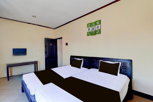 Letto o letti in una camera di Dancenter Jc Boutique Hotel
