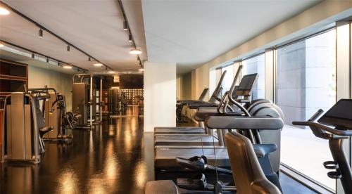 a gym with a row of treadmills and machines at Hyatt Regency Zadar in Zadar