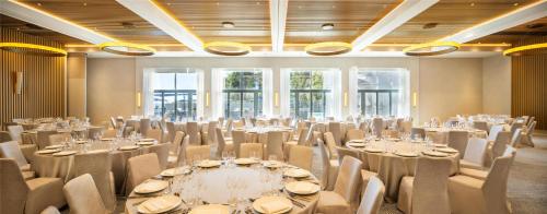 a room with tables and chairs in a room at Hyatt Regency Zadar in Zadar