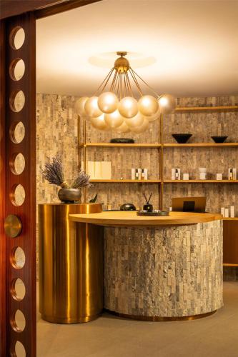 a kitchen with a gold counter and a chandelier at Hyatt Regency Zadar in Zadar