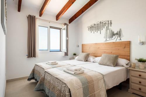 En eller flere senge i et værelse på Villa Vista Mar - Son Bou