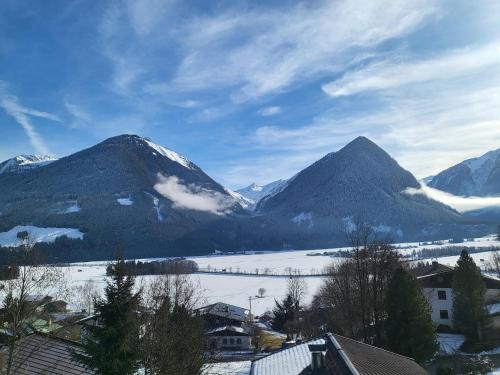 a view of a mountain range with snow covered mountains at Apartment in Neukirchen with a balcony in Neukirchen am Großvenediger