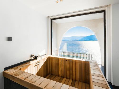 a room with a large window on a boat at Mont XIX Villa - Panoramic Sea & Mountain View in Dali Airport