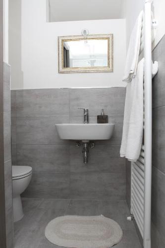 a bathroom with a sink and a toilet at Carducci in Como