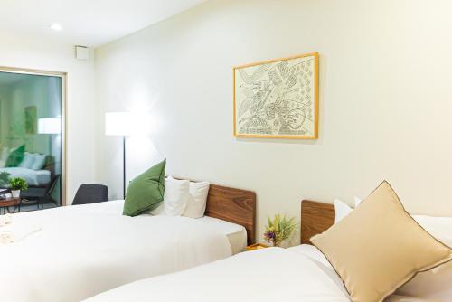 Ένα ή περισσότερα κρεβάτια σε δωμάτιο στο Starry Stay House Shibuya I