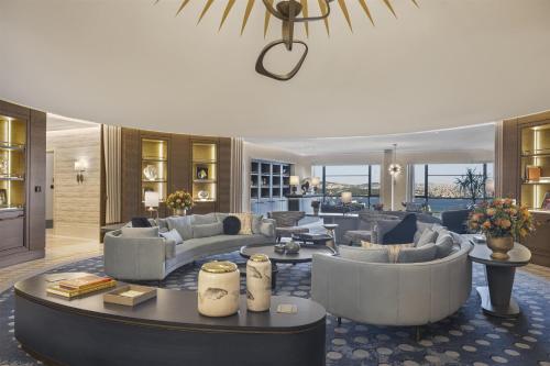 a large living room with couches and a table at Hilton Istanbul Bosphorus in Istanbul