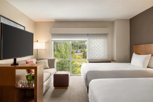 a hotel room with two beds and a large window at Hyatt Place Keystone - Dillon in Keystone